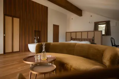 a living room with a couch and a table at Hofgut Antlas in Collalbo