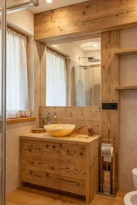 a bathroom with a sink and a mirror at Incantevole appar chalet nuovo in Borca di Cadore