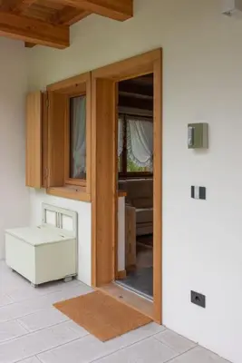 a room with an open door to a room at Incantevole appar chalet nuovo in Borca di Cadore