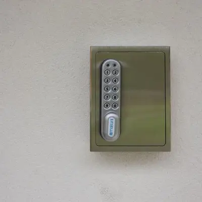 a remote control is attached to a wall at Incantevole appar chalet nuovo in Borca di Cadore