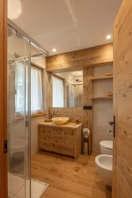 a bathroom with a shower and a sink and a toilet at Incantevole appar chalet nuovo in Borca di Cadore
