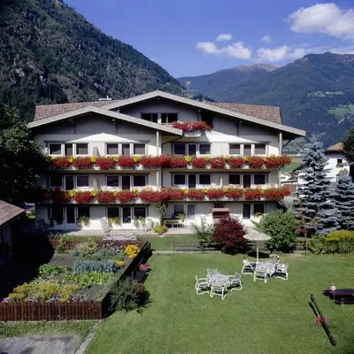 a house with a garden in front of it at Residence Pfeifhofer in Campo Tures