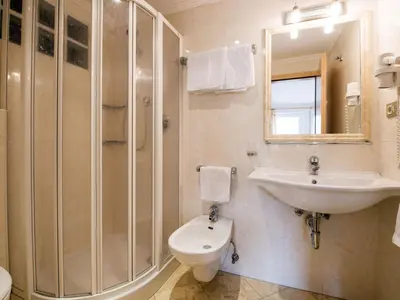 a bathroom with a sink and a shower and a toilet at Apartment Ornella-3 by Interhome in Ortisei