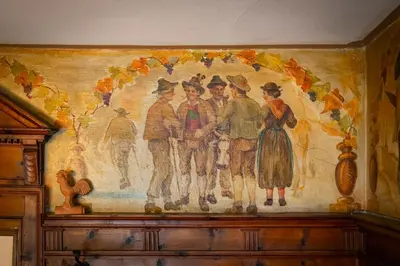 a painting of people on a wall in a room at Kaiserau 1907 in Collalbo