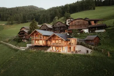 an aerial view of a large wooden house at Lominus Dolomites Luxury Chalet for 2 in San Martino in Badia