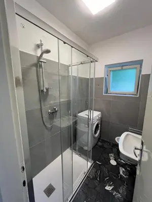 a bathroom with a glass shower and a toilet at Appartamento 135mq - Splendida Vista Sul Lagorai in Cavalese