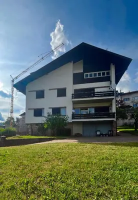 a building with a crane on top of it at Appartamento 135mq - Splendida Vista Sul Lagorai in Cavalese
