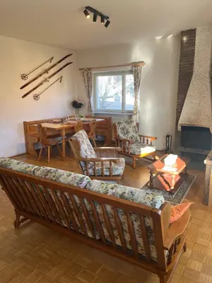 a living room with a couch and a table at Appartamento 135mq - Splendida Vista Sul Lagorai in Cavalese