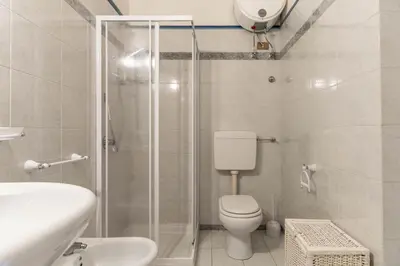 a bathroom with a shower and a toilet and a sink at Dimora al Penegal, Passo Mendola Ospitar in Mendola