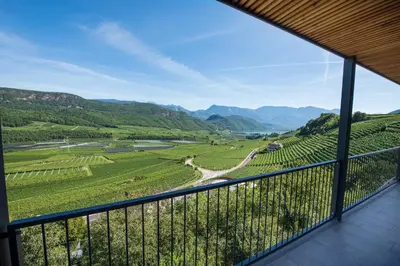 a room with a view of a valley and mountains at Villa Barleit in Caldaro