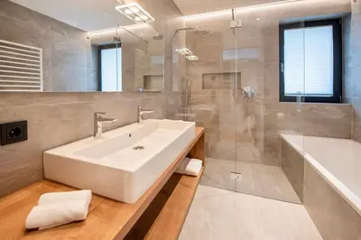 a bathroom with a sink and a shower and a tub at Villa Barleit in Caldaro