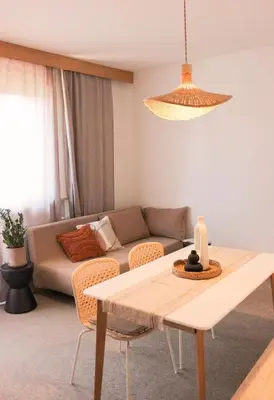 a living room with a couch and a table at haus e Apartment 2 in Lana