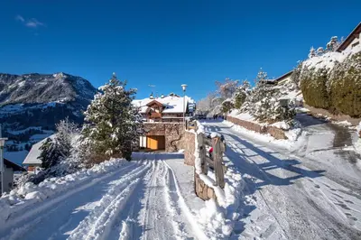 a snow covered road with a house in the distance at Apartment Villa Hetty 2 in Ortisei