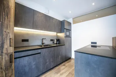a kitchen with a sink and a counter top at Apartment Villa Hetty 2 in Ortisei