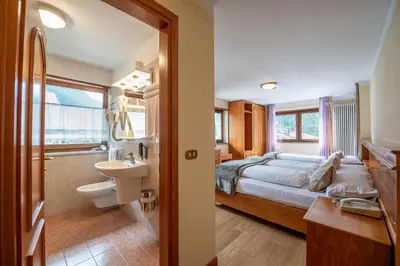 a wooden room with a table in a cabin at De Matie in Canazei