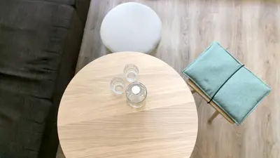 a table with a mirror with a pair of scissors at Flora Hotel & Suites in Merano
