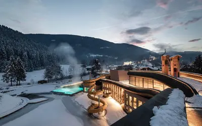 a view of a resort in the snow at Falkensteiner Family Resort Lido l 4 Star Superior in Chienes