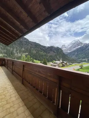 a balcony with a view of a mountain at Cèsa Al Bosch in Alba di Canazei