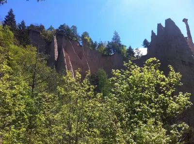 a view of a mountain with trees in the foreground at La cà di nonna Natalia in Brusago