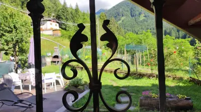 a view of a garden from a window with a view at La cà di nonna Natalia in Brusago