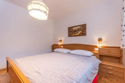 a bedroom with a bed with two pillows on it at Casa Cielo Azzurro in Moena
