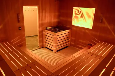 a small room with a small cabinet in a room at SCHLOSSHOF SÜDTIROL - Hotel & Camping Resort in Lana