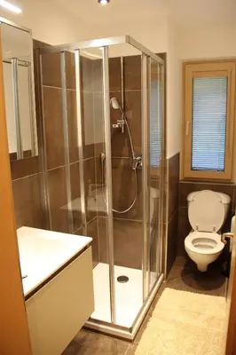 a bathroom with a shower and a toilet at Haus Valier Tiers in Tires