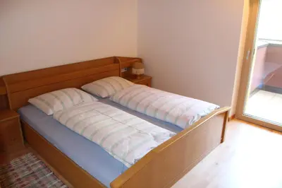 a bed with two pillows on it in a room at Haus Valier Tiers in Tires