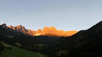 a view of a mountain with the sun shining on it at Haus Valier Tiers in Tires