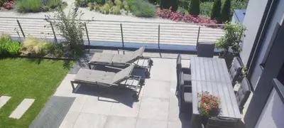 an overhead view of a patio with two lounge chairs at Janas Bolzano Mountain Apartment in Tesimo