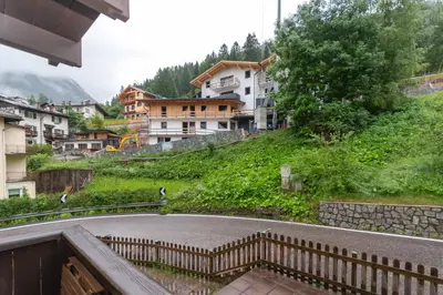 a view of a village with buildings on a hill at Casa Nuccia in Moena