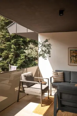 a living room with a couch and a chair at 240qm Luxus Apartment - Natur & Wandern zw Bozen und Meran in Nalles