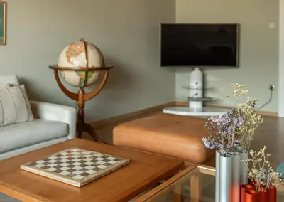 a living room with a chess board on a table at 240qm Luxus Apartment - Natur & Wandern zw Bozen und Meran in Nalles