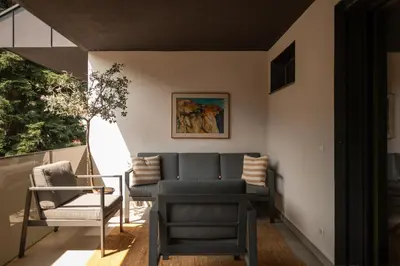 a living room with a couch and a chair at 240qm Luxus Apartment - Natur & Wandern zw Bozen und Meran in Nalles