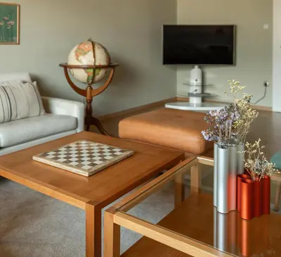 a living room with a coffee table and a couch at 240qm Luxus Apartment - Natur & Wandern zw Bozen und Meran in Nalles