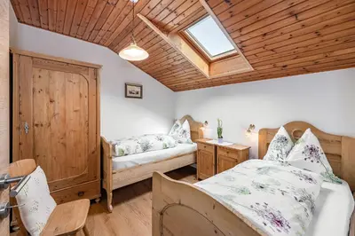 a bedroom with two beds and a skylight at Punterhof in Varna