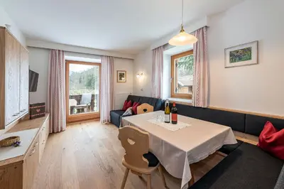 a living room with a table and a couch at Punterhof in Varna