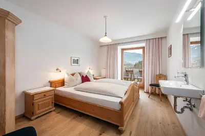a bedroom with a bed and a sink at Punterhof in Varna