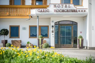 a building with a sign that reads camp hoover at Hotel Garni Hochgruber in Brunico