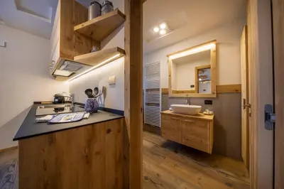 a kitchen with a sink and a counter top at Cesa dele Angele in Colle Santa Lucia