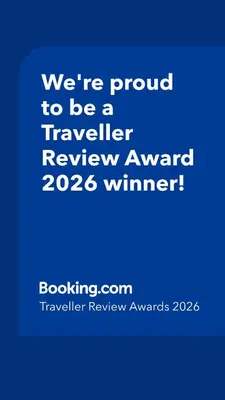 a blue sign that says were proud to be a traveller reviewagency winner at Appartamento Aquila D'oro in Vipiteno