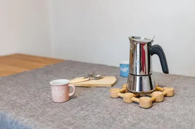 affeepot and a coffee maker on a table at Bilo Cornetto Bianco in Predazzo