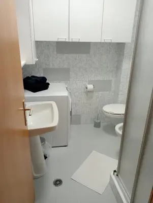 a bathroom with a sink and a toilet at Appartement Margarethen in Vipiteno