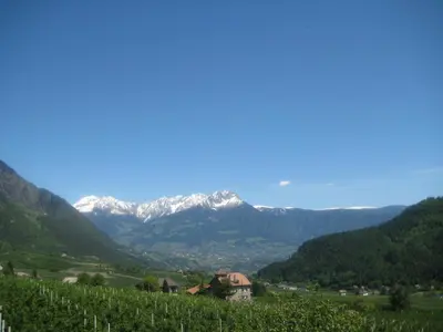 a view of a valley with snow covered mountains at Pföstlhof in Parcines