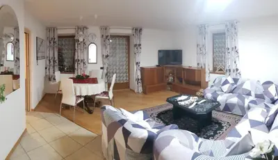 a living room with a couch and a table at Casa Alessio in Sicina