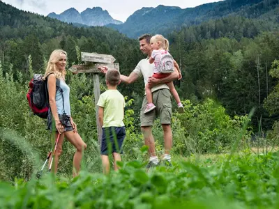 a group of people standing in a field at Family Hotel Gutenberg in Schenna