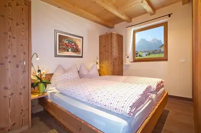 a balcony with a table and a view of a mountain at Apartments Cornelia in Castelrotto