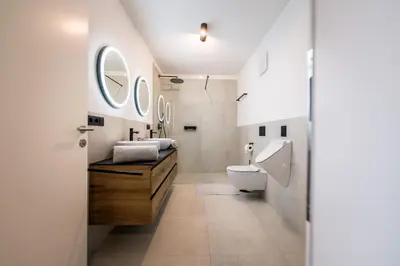 a bathroom with a sink and a toilet at ANDERS City Loft in Brunico