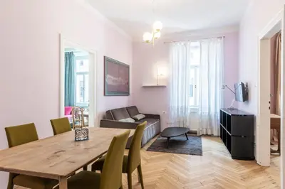 a living room with a table and a couch at Stay COOPER l Laurenz in Bolzano