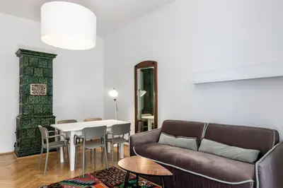 a living room with a couch and a table at Stay COOPER l Laurenz in Bolzano